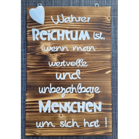 Schild geflammt  " Wahrer Reichtum..."