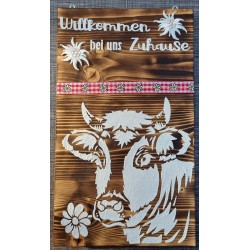 Schild " Willkommen bei uns Zuhause" geflammt