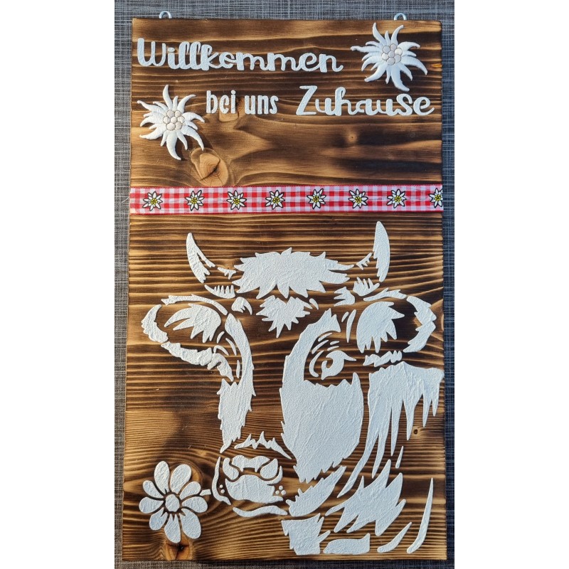 Schild " Willkommen bei uns Zuhause" geflammt