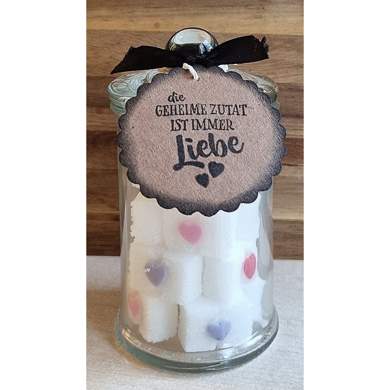 Glas mit Würfelzucker  " Die geheime Zutat...."