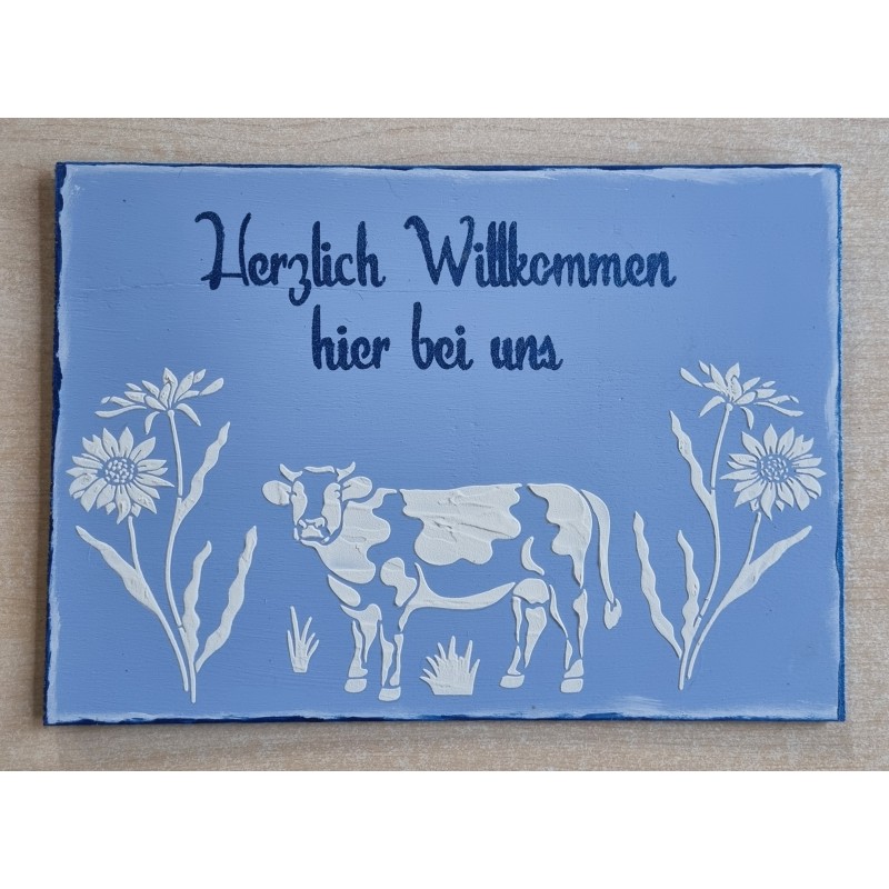 Schild " Herzlich Willkommen hier bei uns " Kuh/blau