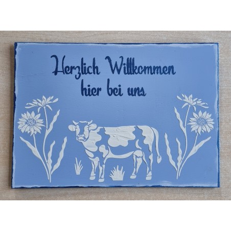Schild " Herzlich Willkommen hier bei uns " Kuh/blau