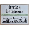 Schild weiss/schwarz/hellgrün " Herzlich Willkommen/Alpenfeeling "