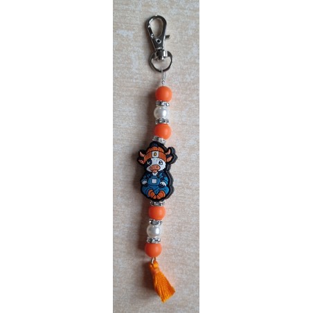Schlüsselanhänger Kuh mit Mütze orange